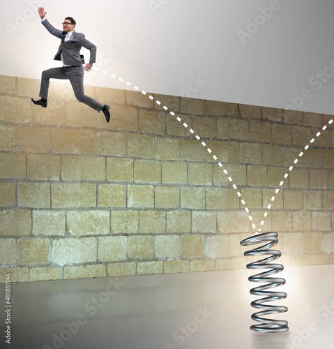 Businessman jumping from spring in business concept
