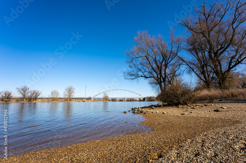 Frühling an der Donau in Straubing unter blauem Himmel - Im Hintergrund die Brücke an der B20 - Bundesstraße photo