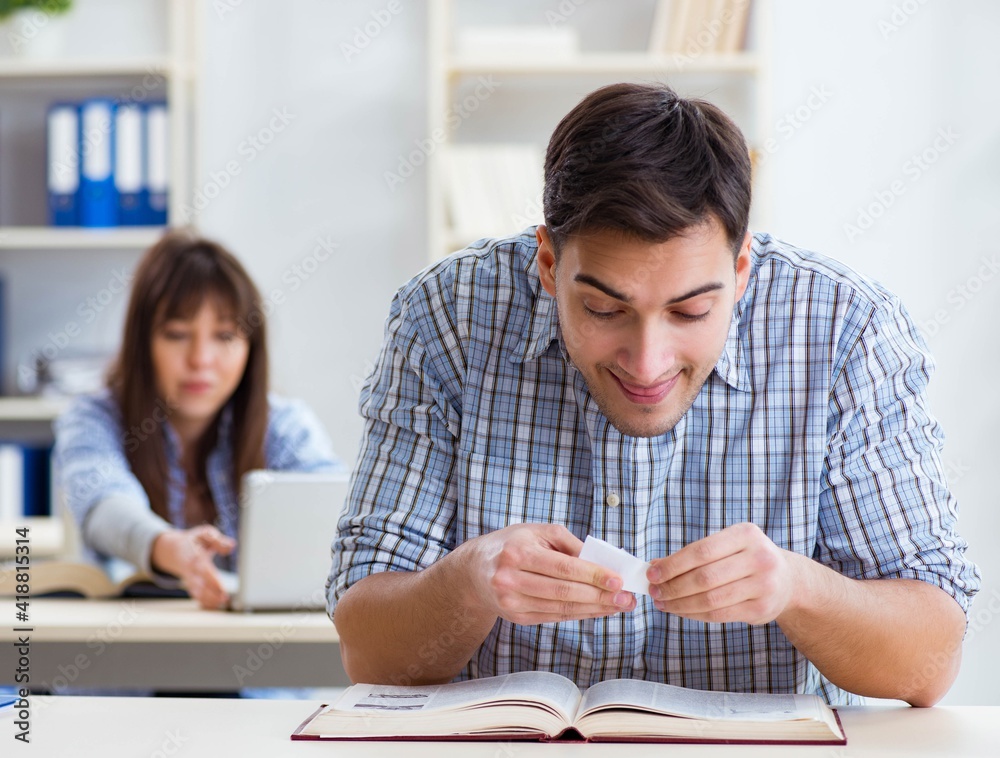 Students sitting and studying in classroom college Students sitting and studying in classroom college