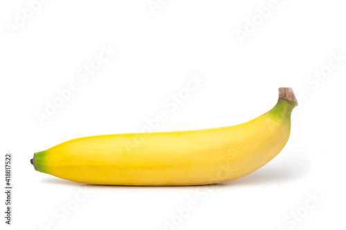 One yellow tasty banana on a white background