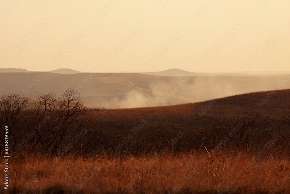 smoke in the prairie hills during a wildfire burning