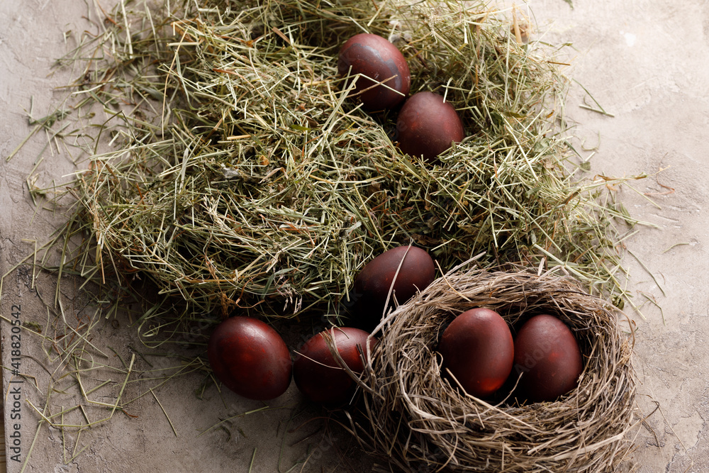 Still life many colorful easter eggs on a textural background. Rustic. Decoration from natural herbs. Easter celebration concept. Still life many colorful easter eggs on a textural background. Rustic. Decoration from natural herbs. Easter celebration concept.