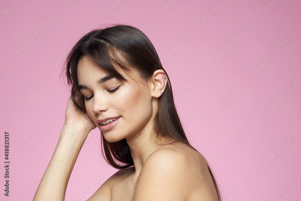 brunette bare shoulders clear skin body care pink background brunette bare shoulders clear skin body care pink background