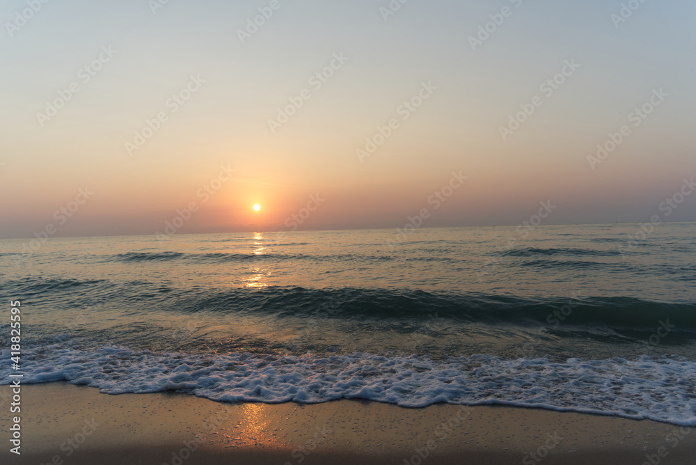 waves on the beach at sunrise Cha-am Phetchaburi near Bangkok, Thailand