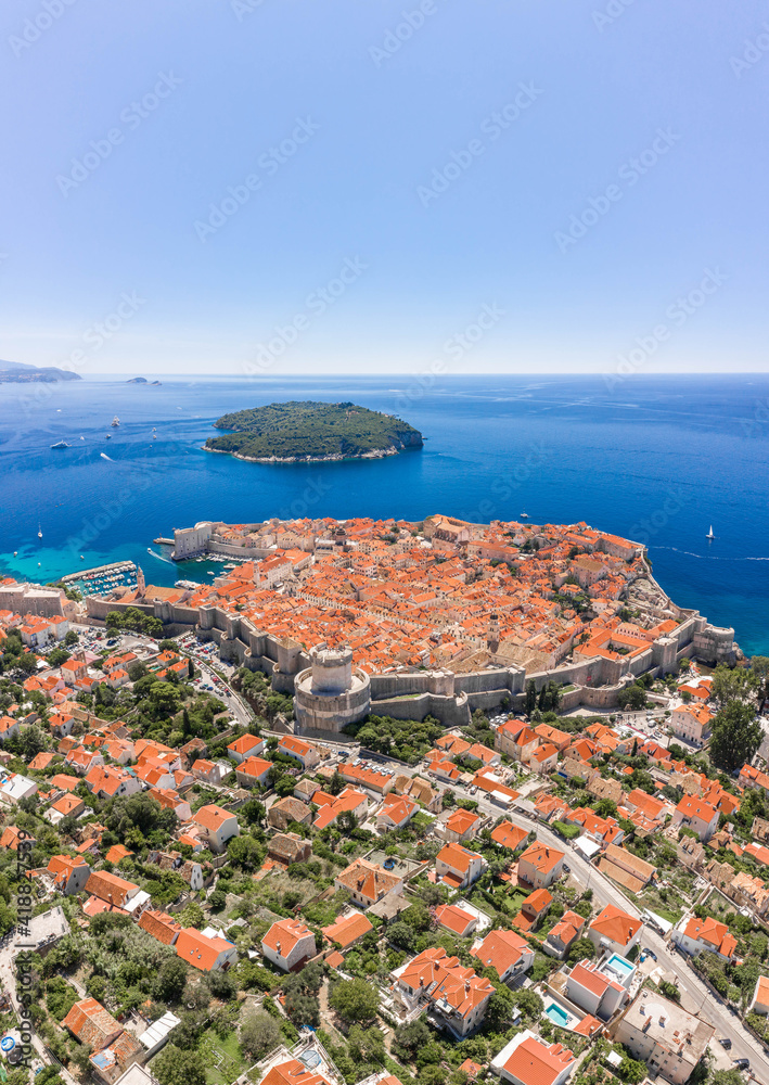 Naklejka premium Aerial drone shot of Otok Lokrum in Adriatic sea near Dubrovnik old town in Croatia summer noon