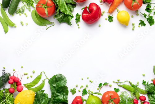 Healthy food vegetarian food background. Frame of fresh vegetables and fruits on white background top view