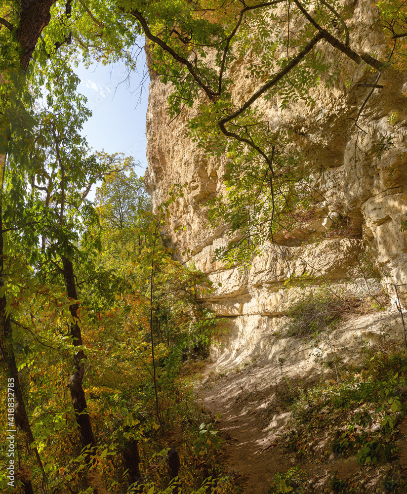 Autumn nature walks along a mountain canyon on a warm autumn day, along a difficult route. Autumn nature walks along a mountain canyon on a warm autumn day, along a difficult route.