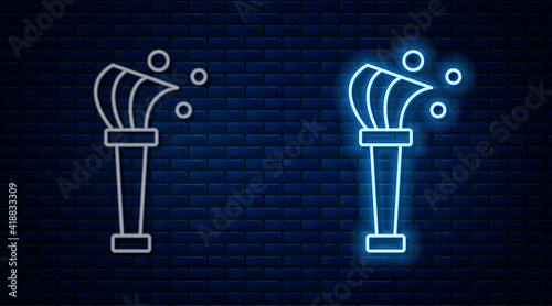 Glowing neon line Aspergillum icon isolated on brick wall background. Vector.