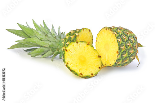 Cut tasty pineapple and slice isolated on white