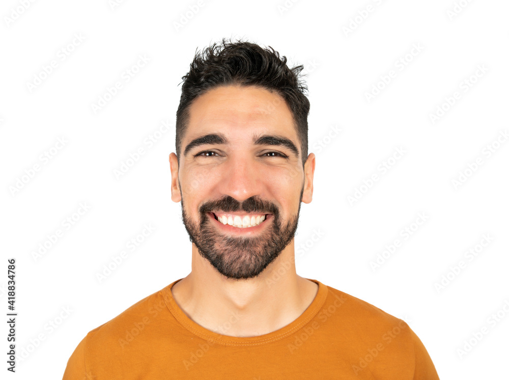 Obraz premium Young man smiling against white background.