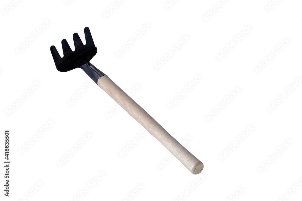 Steel rake with wooden handle isolated on white background Clipping path. Steel rake with wooden handle isolated on white background Clipping path.