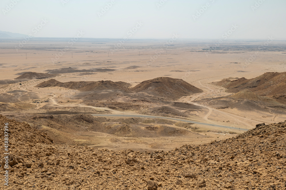 Desert road in remote rural area of Tabuk in north western Saudi Arabia Desert road in remote rural area of Tabuk in north western Saudi Arabia