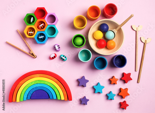 Eco-friendly colored wooden educational toys based on the Montessori method. Wooden rainbow, sorted by color. Copy space