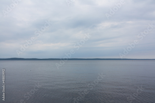 Blue sea or ocean water surface, underwater with sunny and cloudy sky