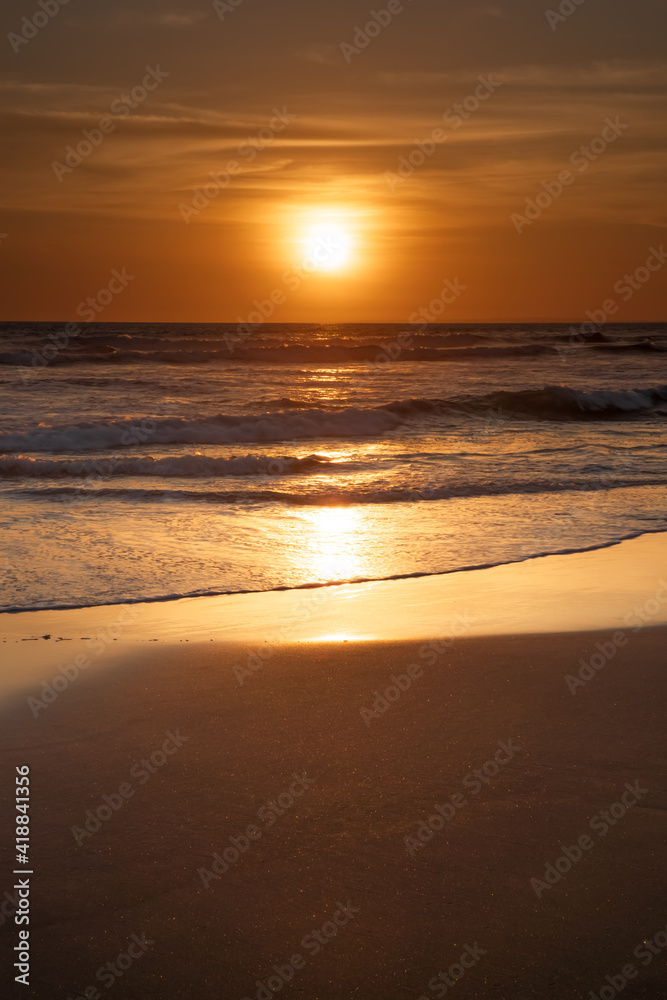 Sunset and beach. Seascape background. Bright sunlight. Sun at horizon line. Scenic view. Sunset golden hour. Sunlight reflection in water. Magnificent scenery. Copy space. Bali