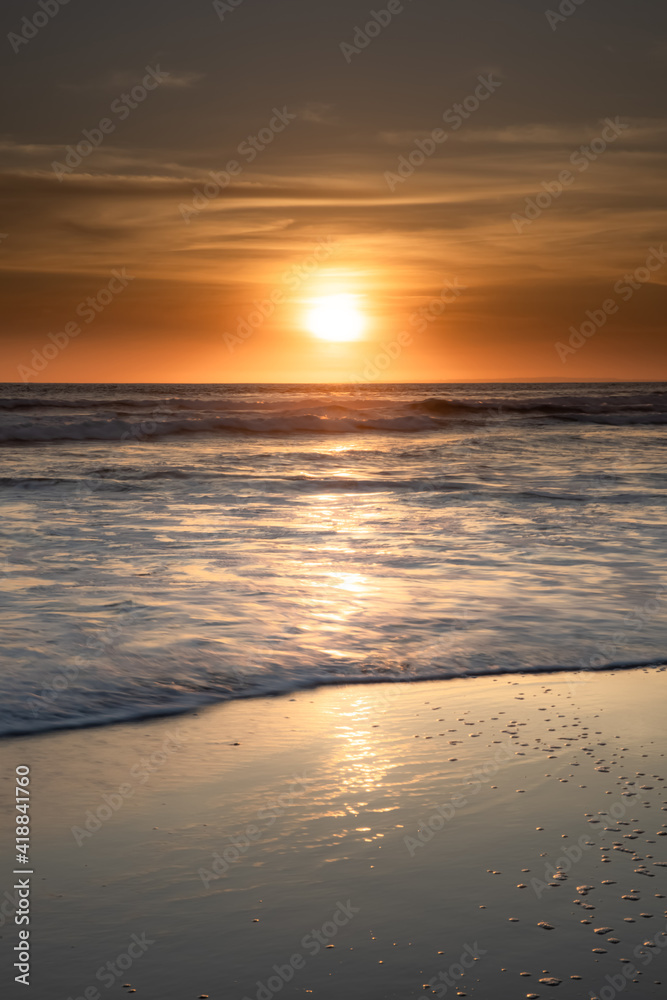 Sunset and beach. Seascape background. Bright sunlight. Sun at horizon line. Scenic view. Sunset golden hour. Sunlight reflection in water. Magnificent scenery. Copy space. Bali Sunset and beach. Seascape background. Bright sunlight. Sun at horizon line. Scenic view. Sunset golden hour. Sunlight reflection in water. Magnificent scenery. Copy space. Bali