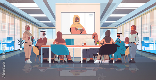 team of arabic medical specialists having video conference with female black muslim doctor medicine healthcare concept hospital meeting room interior horizontal full length vector illustration