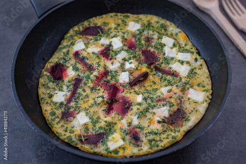 vegetable frittata with beetroot, feta cheese and herbs