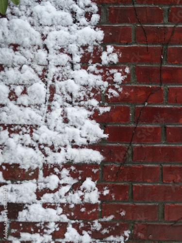 Red brick chimney with snow