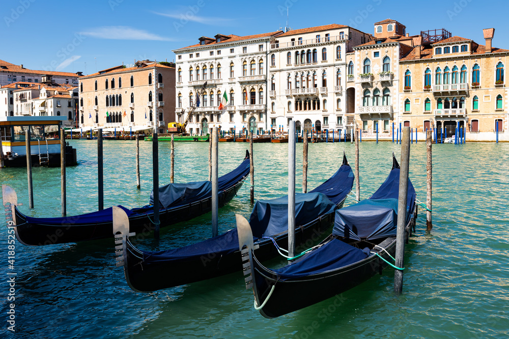 Cityscape image of main Venetian canal Grand Canal with old architecture and gondolas