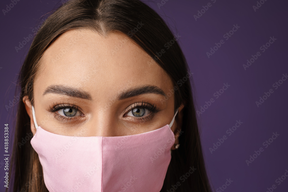 Beautiful brunette caucasian girl posing in protective mask Beautiful brunette caucasian girl posing in protective mask