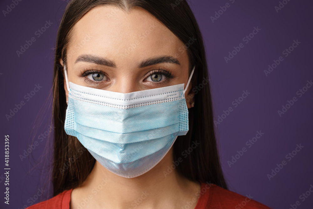 Beautiful brunette caucasian girl posing in protective mask Beautiful brunette caucasian girl posing in protective mask