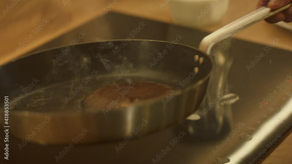 Man Grabs Frying Pan. Young Man Cooking In The Kitchen. Man Grabs Frying Pan. Young Man Cooking In The Kitchen.