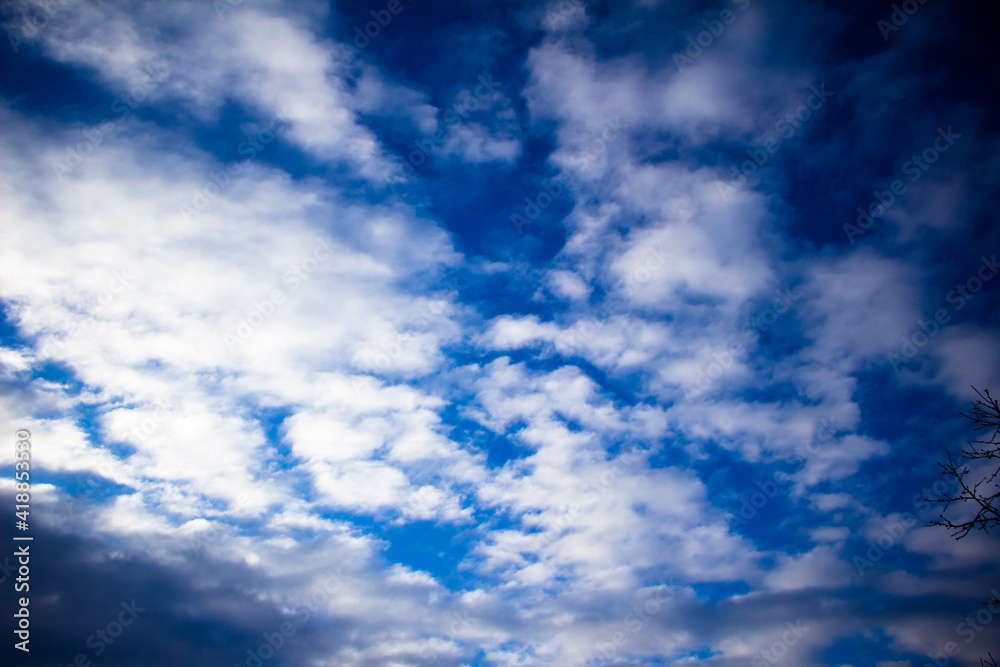 Fototapeta premium Spring March sky with white fluffy clouds Ukraine