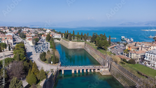 Aerial view of the ancient fortified town of Peschiera dal Garda, protected by mighty Renaissance walls and canals that surround it.