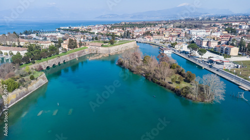 Aerial view of the ancient fortified town of Peschiera dal Garda, protected by mighty Renaissance walls and canals that surround it.