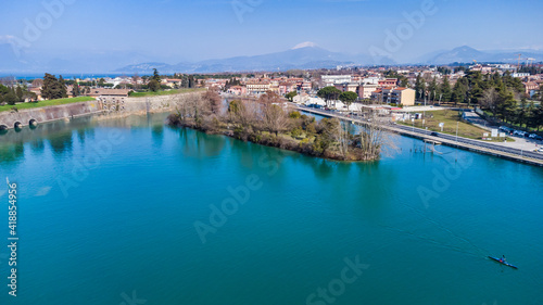 Aerial view of the ancient fortified town of Peschiera dal Garda, protected by mighty Renaissance walls and canals that surround it. © strenghtofframe