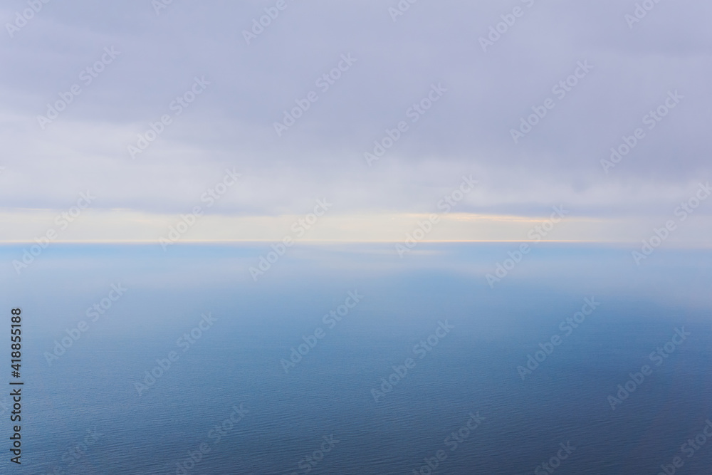 foggy rainy sea to horizon, bird's eye view
