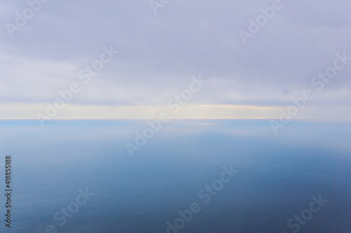 foggy rainy sea to horizon, bird's eye view © Evgeny