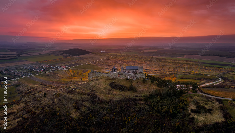 Boldogko, Hungary - Aerial panoramic view of Boldogko Castle (Boldogko vára/Boldogkováralja) at autumn season with a beautiful colorful golden sunset. The castle can be found in the Zemplen Mountains