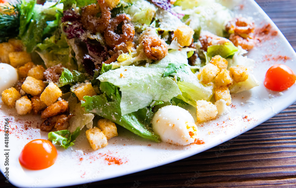 caesar salad on a plate close up caesar salad on a plate close up