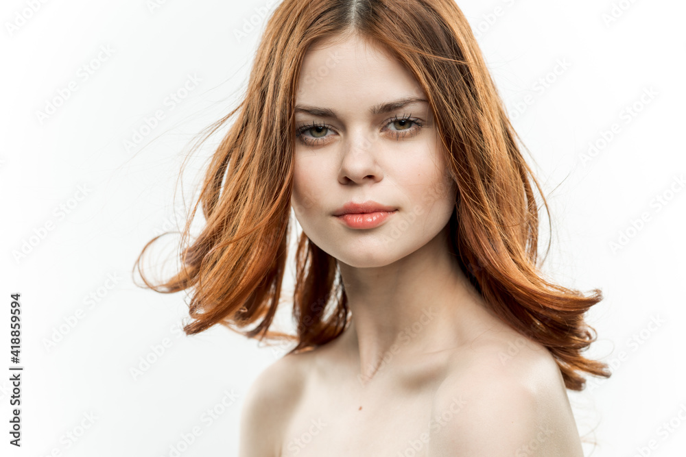 Naklejka premium pretty woman red hair passionate gaze naked shoulders model