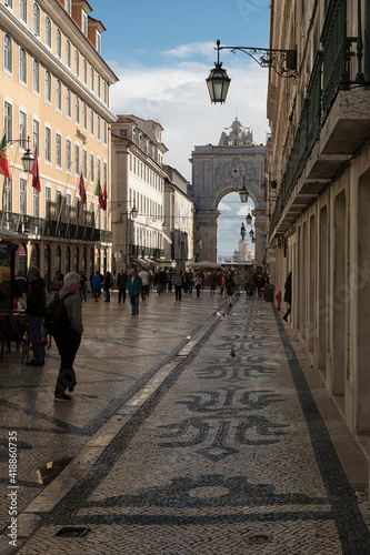 Rua Augusta and Arco da Vitoria people walking along the Rua Augusta, with the arco da Vitoria in the background photo