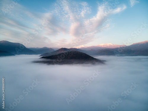 Aerial view, beautiful of morning scenery sea of cloud and the fog flows on high mountains. Russia © ASHarchenko