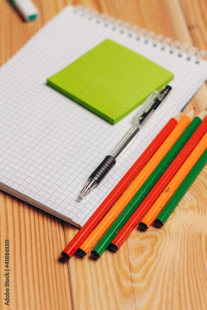 notepads pencils office work paper wood background