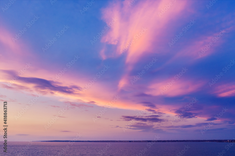 Colorful cloudy sky above the sea during sunset