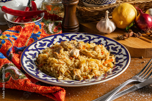 Traditional Uzbek pilaf with chicken and vegetables