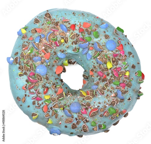 Top view of sweet donut with blue icing and crushed candies. Close Up of a round confectionery. Donut on a white background. Sweet dish. Ready to eat. Sweet decorated donut filled with chocolate.