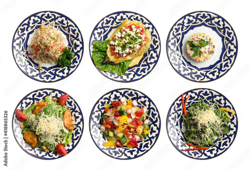 A set of salads and cold appetizers in plates with a traditional Uzbek pattern. A set of salads and cold appetizers in plates with a traditional Uzbek pattern.