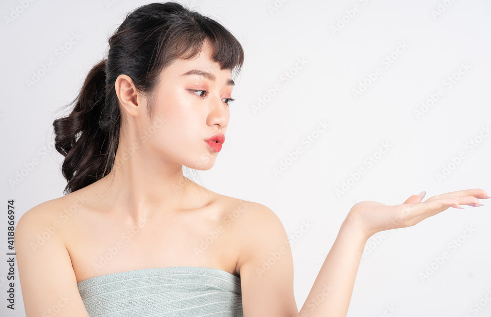 Young Asian woman with beautiful skin on white background Young Asian woman with beautiful skin on white background
