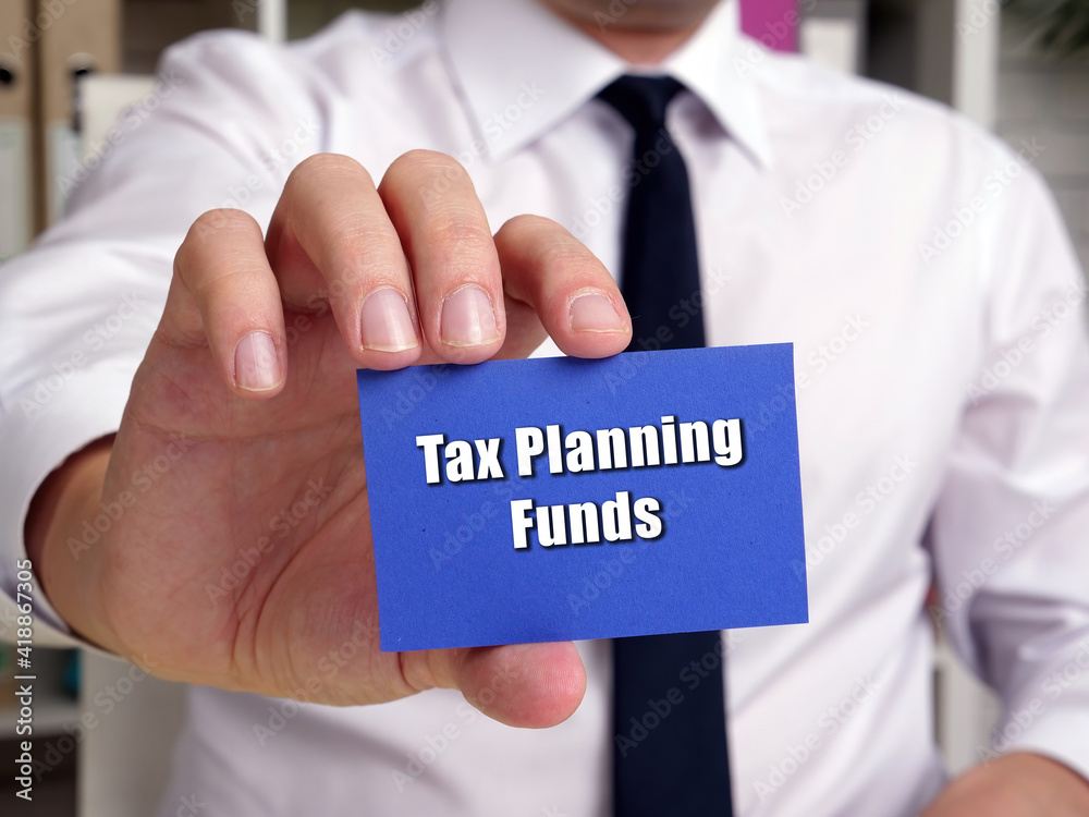Business concept about Tax Planning Funds with sign on the sheet. Business concept about Tax Planning Funds with sign on the sheet.