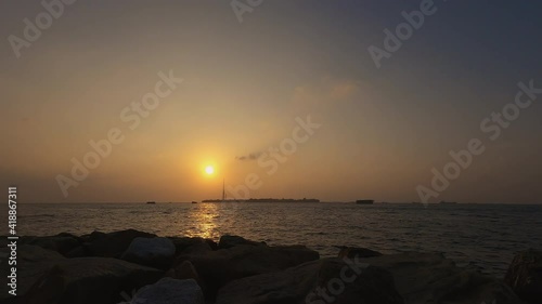 4K Time lapse. Romantic colorful sunset at the Indian ocean, Maldives, Villingili, February 2021 photo