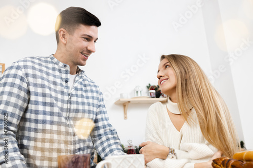 Portrait of a young sweet couple in kitchen