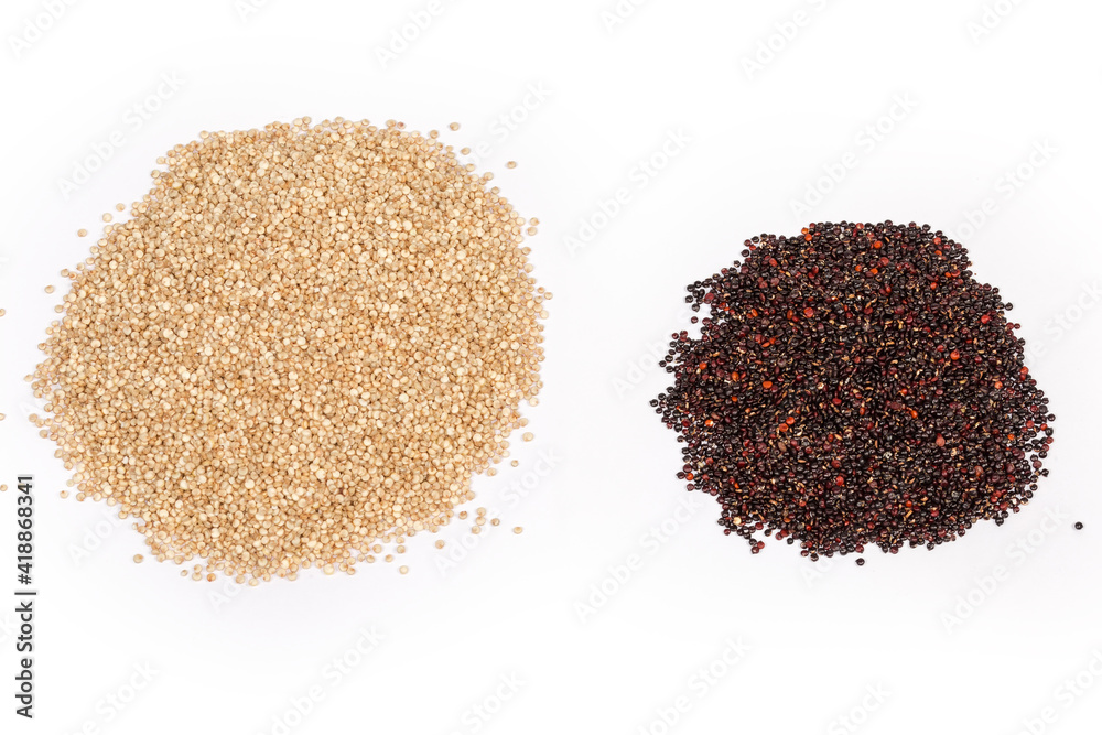 Two piles of raw red and white quinoa seeds