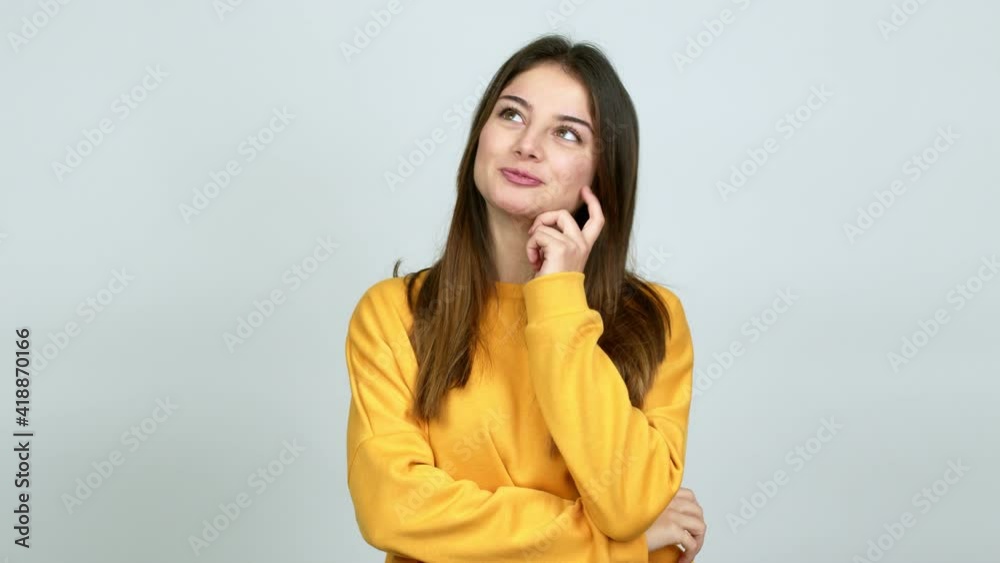 Young caucasian woman standing and thinking an idea pointing the finger up over isolated background Young caucasian woman standing and thinking an idea pointing the finger up over isolated background