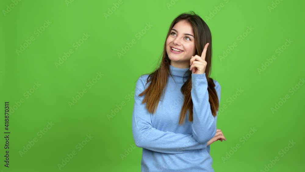 Young caucasian woman standing and thinking an idea pointing the finger up over isolated background. Green screen chroma key Young caucasian woman standing and thinking an idea pointing the finger up over isolated background. Green screen chroma key